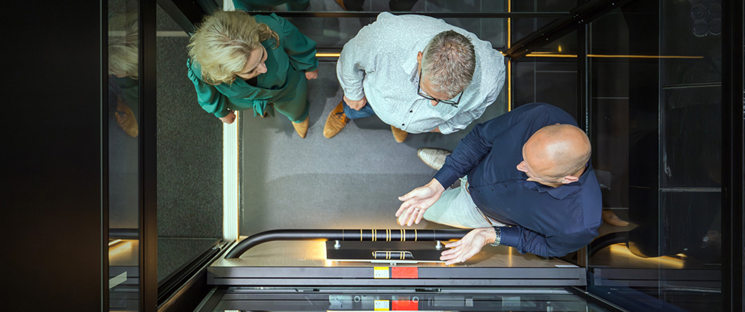 People Looking At Buying An Elevator